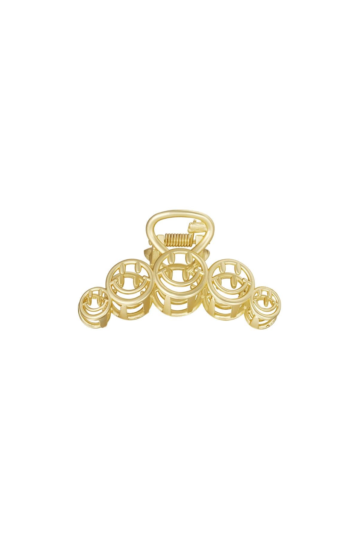 Grote goudkleurige vintage haarclip met zes smiley face details van metaal