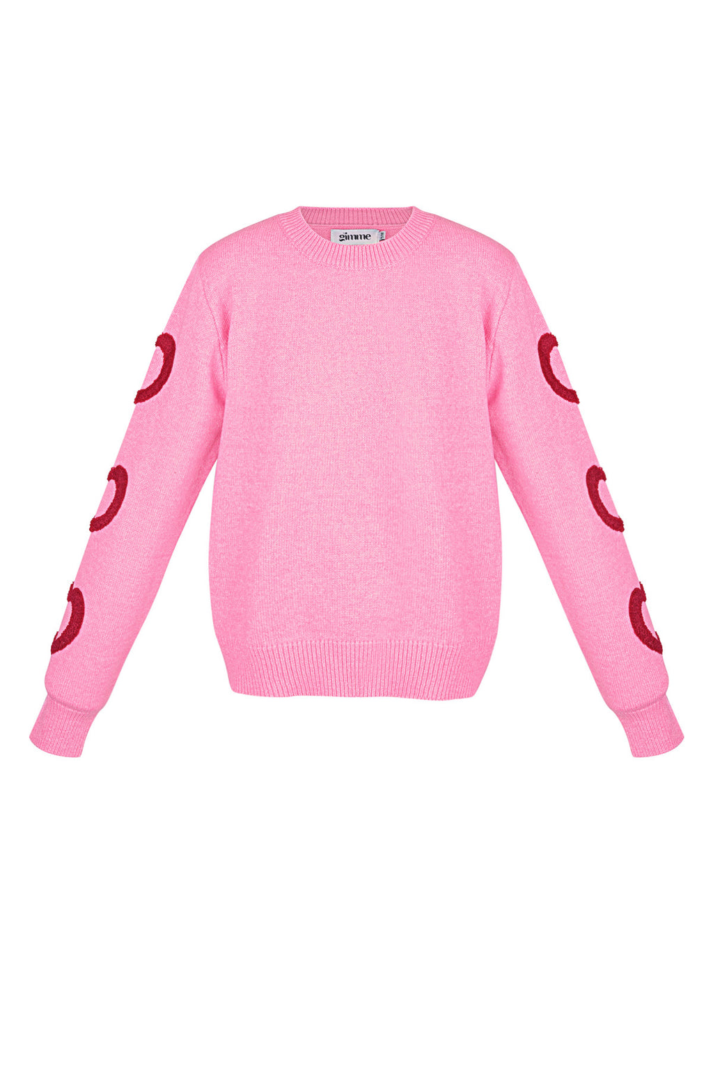 Roze gebreide trui met rode hart details op de mouwen