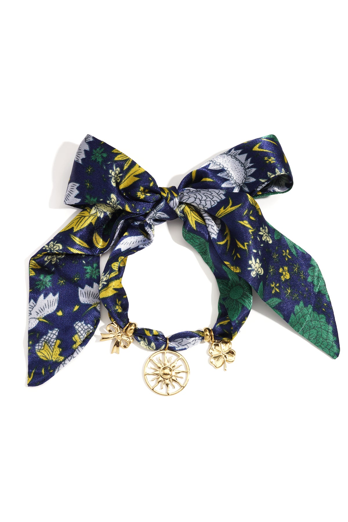 Blauwe textiel armband met goudkleurige zonneschijf charm en strikdetail