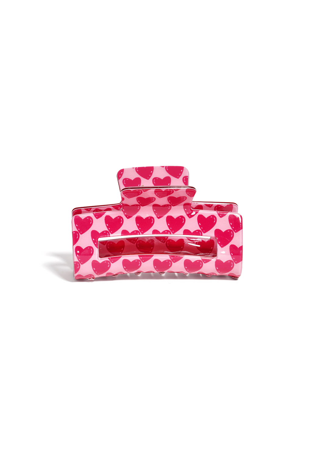Roze haarspeld van acryl met wit en roze hartjespatroon